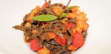Home made black tagliolini with shrimps